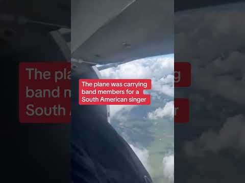 Aircraft door hangs opens mid-flight
