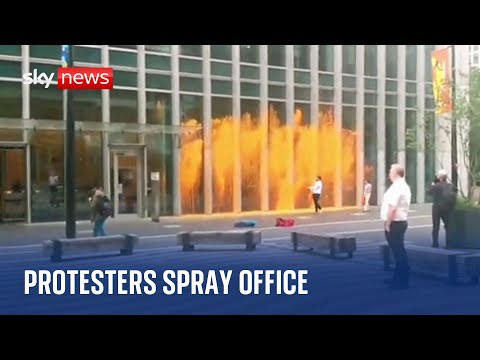 Just Stop Oil: Protesters throw paint at office building in Canary Wharf