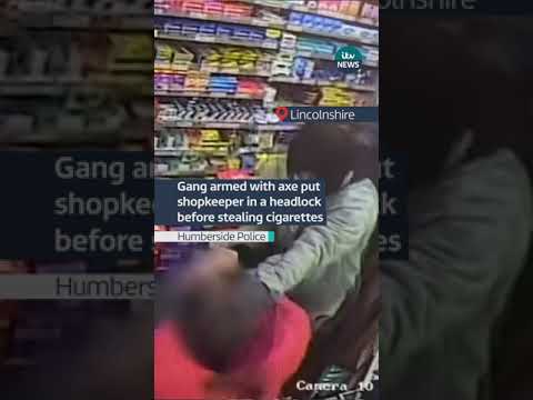 Gang armed with axe put shopkeeper in a headlock before stealing cigarettes #itvnews