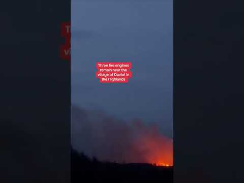 Six fire engines remain near the village of Divot in the highlands after a fire broke out