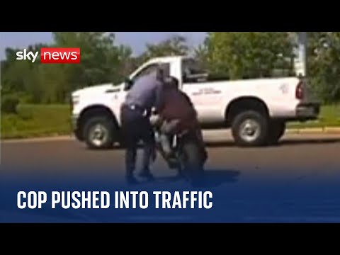 Police officer pushed into traffic by motorcyclist ‘driving erratically’