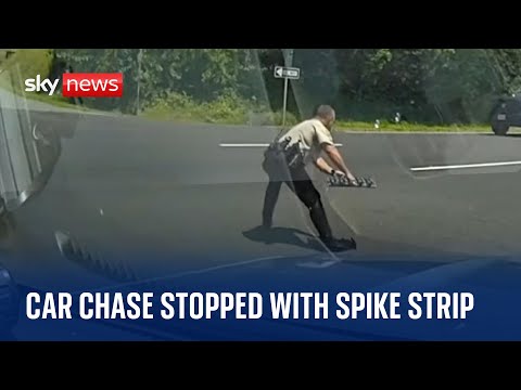 US: Police officer stops car chase by bursting suspect’s tyres with spike strip