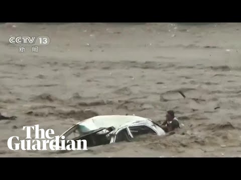 Man rescued from car swept into river as Typhoon Doksuri hits China