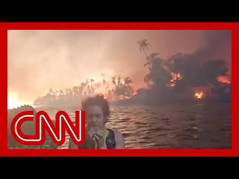 Dramatic video shows family escaping into ocean as Lahaina burns
