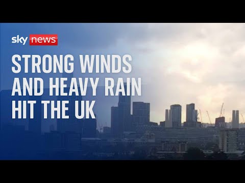 Watch live: Strong winds and heavy rain sweep across the UK