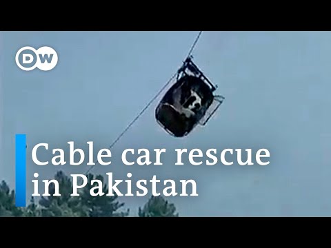 Pakistan: Locals rescue people trapped in a dangling cable car | DW News