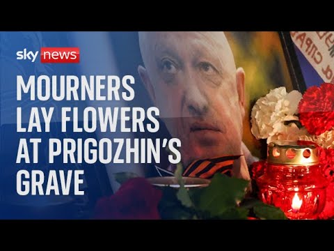 Mourners lay flowers following Wagner boss Yevgeny Prigozhin’s private funeral