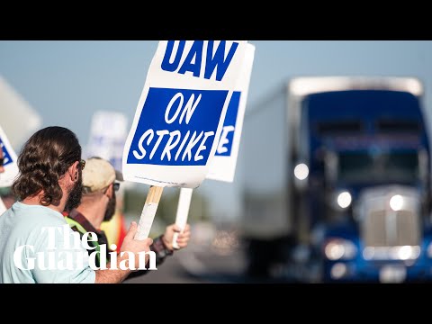 ‘This is history’: car workers walk out in biggest auto strike in generations