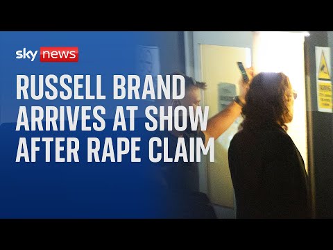 Russell Brand arrives at show after rape and sex assault claims