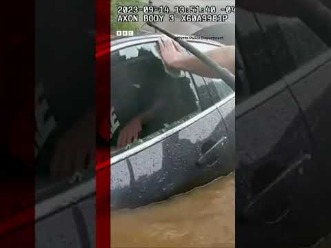 The moment a US police officer smashed a car to rescue a man from drowning #Shorts #BBCNews
