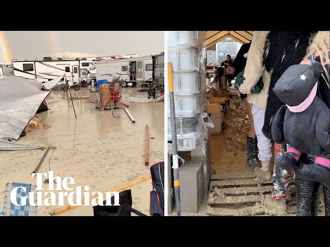 Burning Man festivalgoers surrounded by mud in Nevada desert