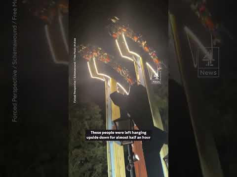 Passengers stuck hanging upside down