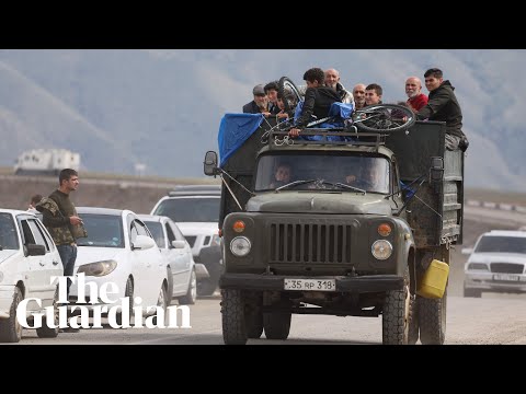 ‘I’ll never return’: thousands flee Nagorno-Karabakh after Armenia regains control
