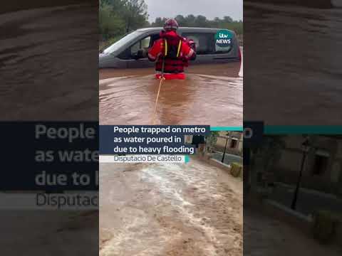 People trapped on metro as water poured in due to heavy flooding #itvnews #spain #madrid #flood