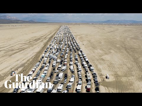 Drone video shows vehicles leaving Burning Man festival after days stranded in thick mud