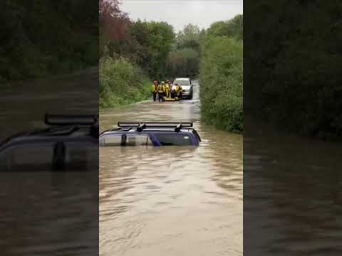 People rescued from roof of car in floods