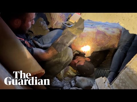 ‘My wife? Ahmed?’: father asks after family while stuck under rubble in Gaza
