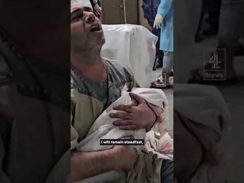 Gazan man holds his dead 2-month-old