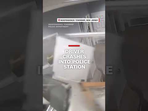 Driver crashes into police station