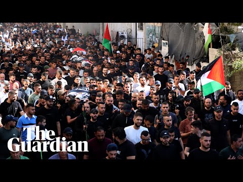 Crowds attend funeral procession for Palestinians killed in West Bank raid