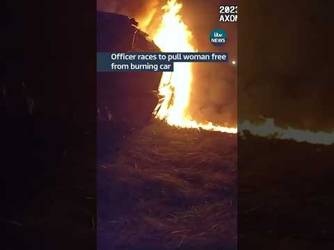 Officer races to pull woman free from burning car #itvnews #usa #police