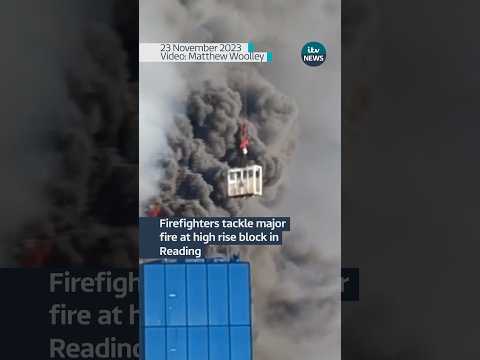 A crane rescues a worker next to a burning high rise in Reading #itvnews #news #reading #fire