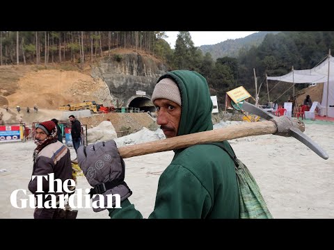 India tunnel collapse: rescuers start drilling downwards after safer options fail