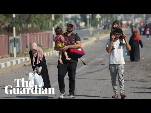 Palestinians walk south inside Gaza as food and supplies run out