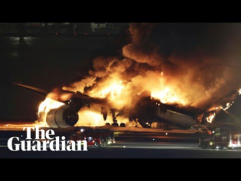 Japan: plane engulfed in flames after colliding with coastguard aircraft