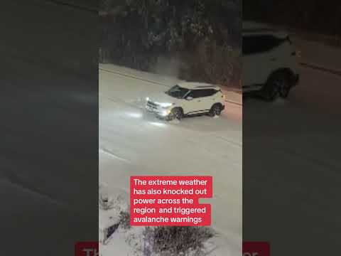 Car slides along road amid avalanche warnings in British Columbia region