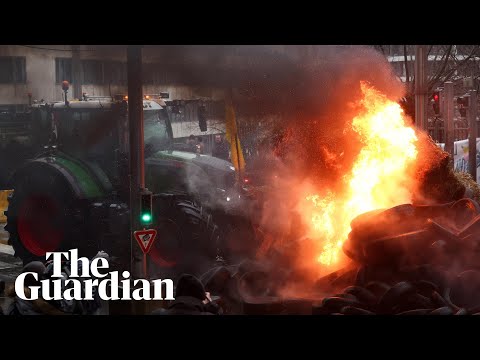 Farmers set fire to tyres in Brussels as EU officials meet to address concerns