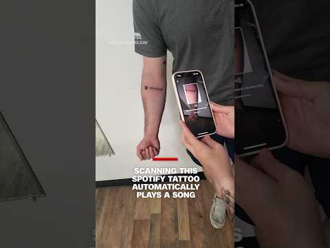 Scanning this Spotify tattoo automatically plays a song