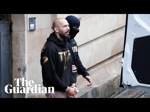 Handcuffed Tate brothers leave court after hearing