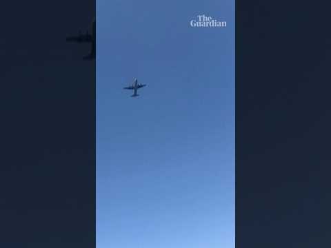Footage shows US planes flying by while conducting aid airdrop