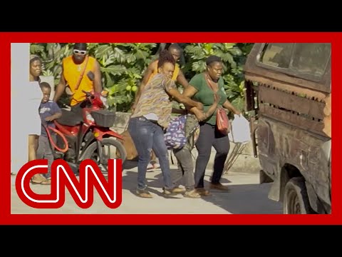‘Oh my God’: Mothers shield children’s eyes from horrific scene in Haiti