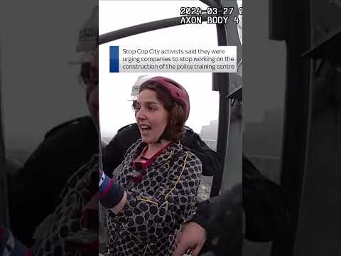 Protesters lock themselves on top of crane
