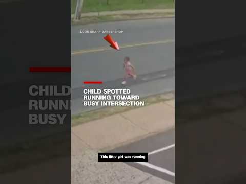 Child spotted running toward busy intersection
