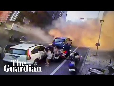 Building collapses on busy street as powerful quake hits Taiwan