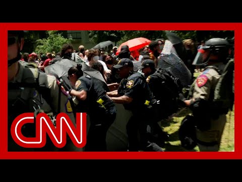 Watch moment police tear down protesters’ barrier at University of Texas at Austin