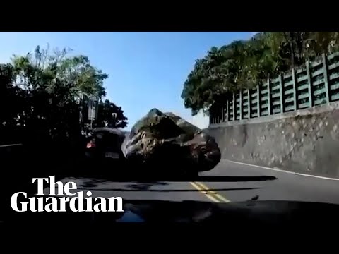 Taiwan earthquake sends boulder crashing into car