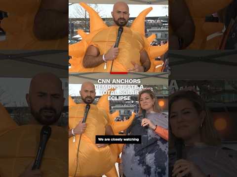 CNN anchors demonstrate a total solar eclipse