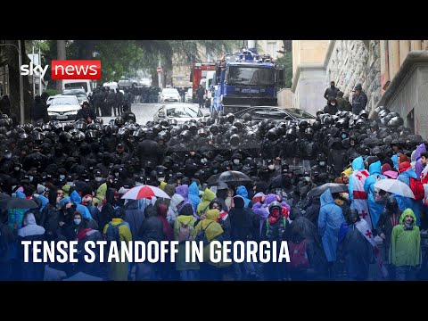Georgia: Tense standoff on streets as protesters try to block MPs from entering parliament