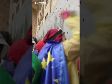 Protesters break through Georgian parliament barricades