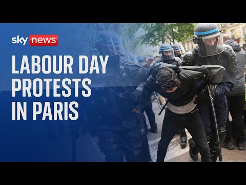 Police clash with protesters during demonstrations in Paris