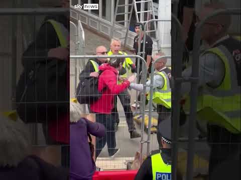 Reform UK leader Nigel Farage dodges objects thrown by protester
