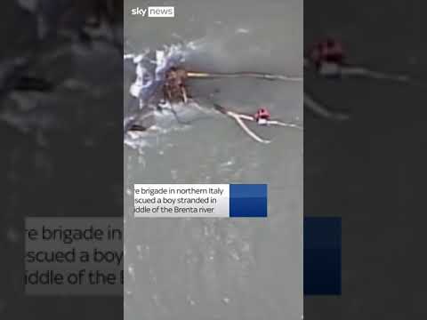 Boy rescued from flooding in Italy