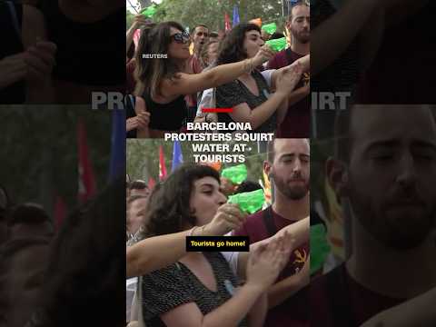 Barcelona protesters squirt water at tourists
