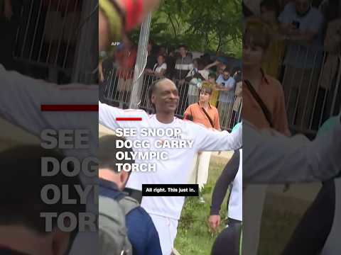 ‘Lighting it up’: Watch Snoop Dogg carry Olympic torch