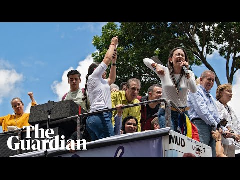 Thousands rally in Venezuela as Maduro threatens to detain defiant leaders of opposition