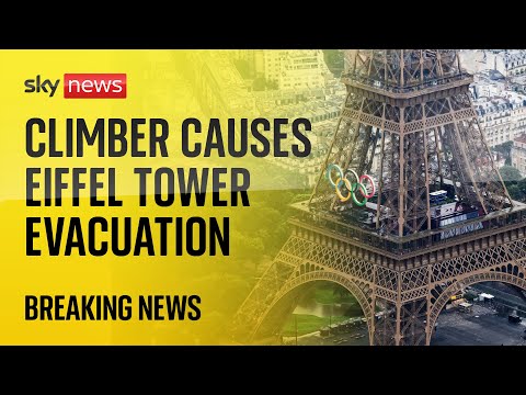 Eiffel Tower evacuated after shirtless man climbs landmark